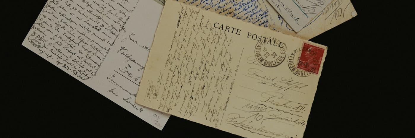 A stack of old envelopes, worn at the corners